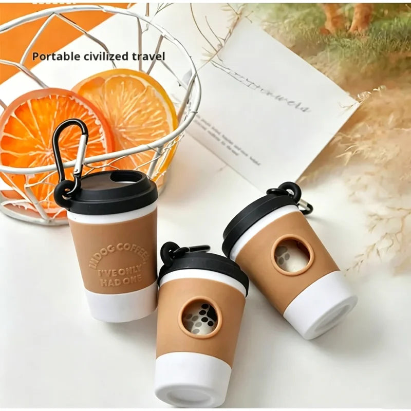 Coffee cup poop bag dispenser, black and white lids on a table