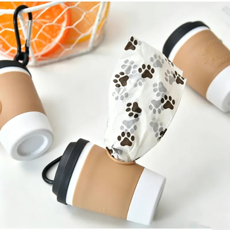 Coffee cup poop bag dispenser with paw-print bags