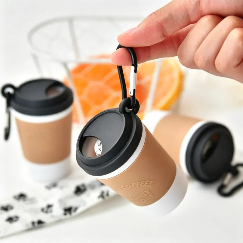 Coffee cup poop bag dispenser, pulling out a bag